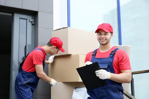 Moving boxes and a house exterior in Barnes