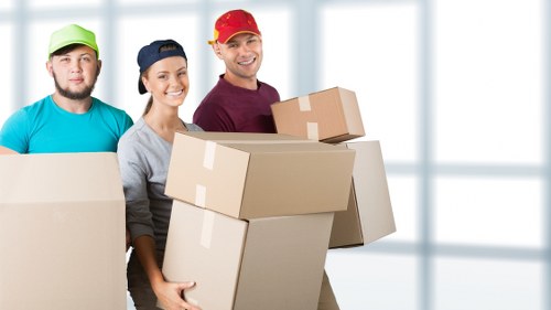 Professional movers handling office furniture during a Barnes relocation