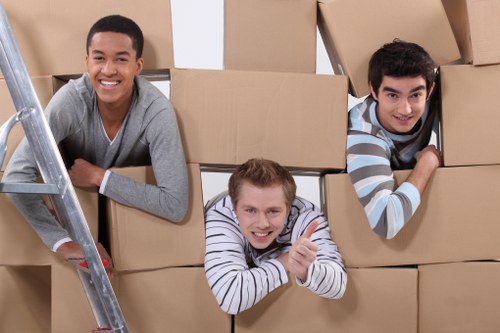 House removals team handling furniture in Barnes