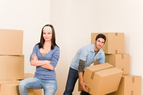 Professional movers loading household items from a Barnes property