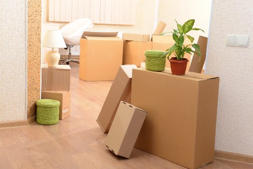 Professional moving team preparing items for transport in Barnes